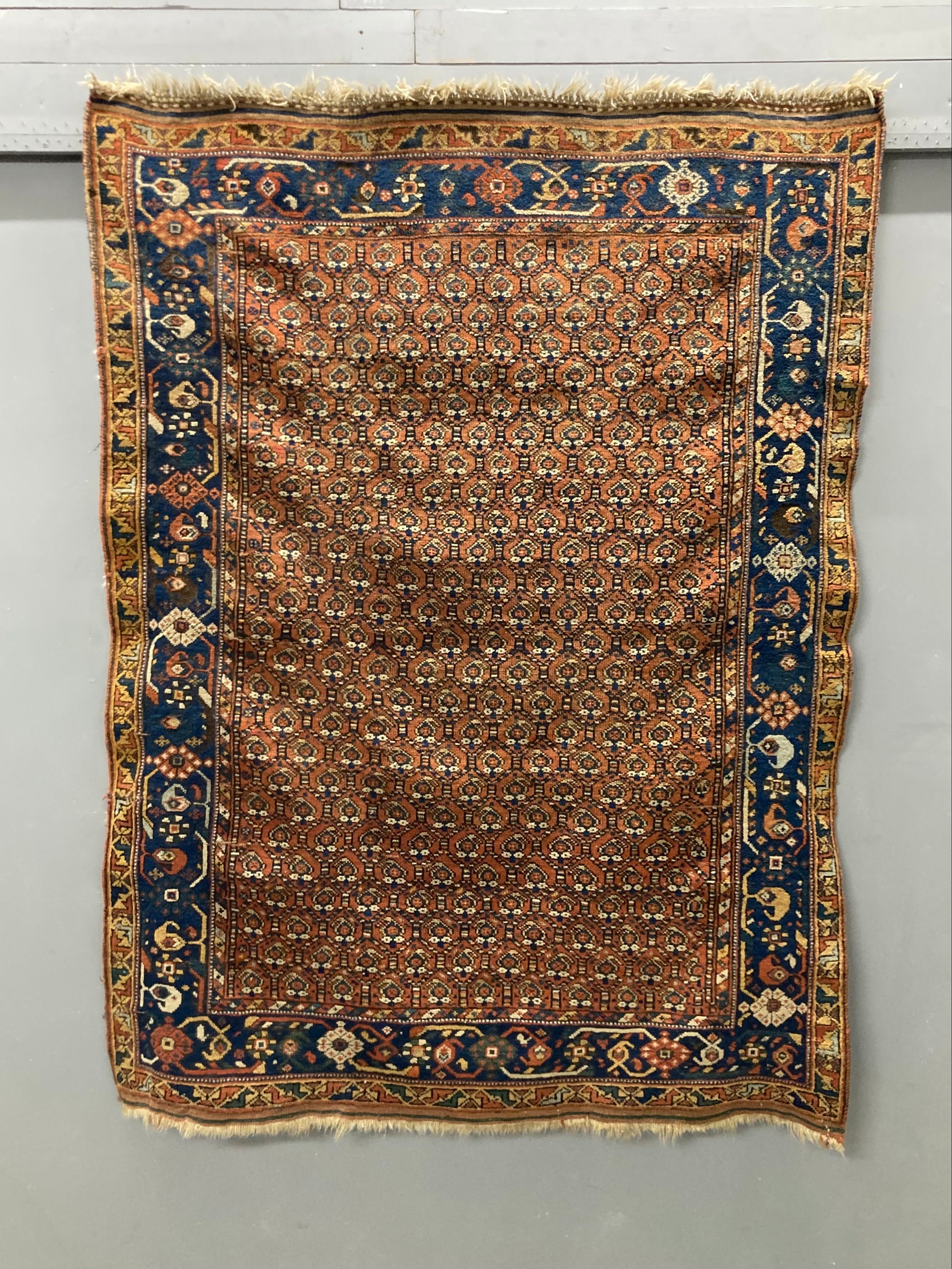 Afshar antique red/orange ground rug with lattice design (191 x 146cm)